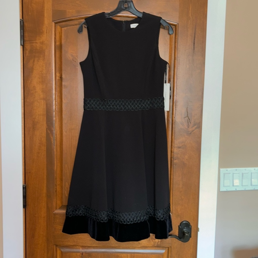 Beautiful black Calvin Klein party dress with lace trim and velvet hem